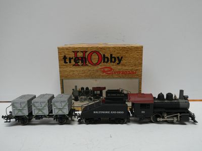 a small toy train set with a box on the side