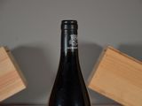 a bottle of wine that is sitting on a table