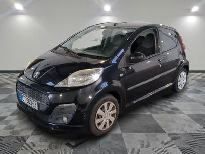 a picture of a small black car on a checkered floor
