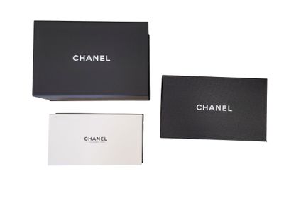 a black box with a white and black logo on it