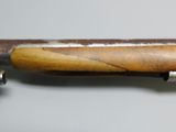 a knife that is laying on top of a piece of wood