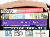 a box full of books sitting on top of a table