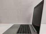 an open laptop computer sitting on top of a white table