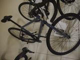 three bikes hanging on the wall next to each other