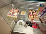 a glass display case filled with different types of cupcakes