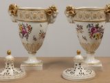 two vases that are sitting on a table