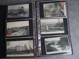 an old photo album with a lot of old photos on it