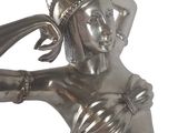 silver statue of a woman with a hat on her head