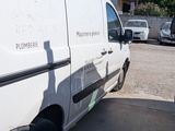 a white van that is parked in a parking lot