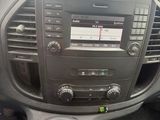 a car dashboard with a radio and a steering wheel