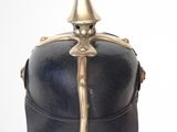 a black helmet with a gold decoration on it