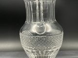 a glass vase that is sitting on a table