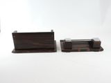 pair of wooden bookends with a black and brown design