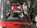 a forklift truck that is parked in a warehouse