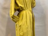a yellow trench coat on a mannequin mannequin mannequin mannequin mannequin mannequin mannequin mannequin manne