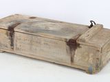 an old wooden box that is sitting on a white surface