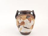 a vase with a picture of a man and a woman on it