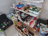 a room with a lot of tools and supplies on the shelves
