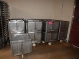 many metal containers stacked on top of each other in a room