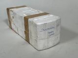 a white box with a brown ribbon on it
