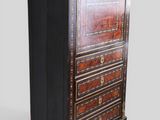 an antique chest of drawers with a wooden top and gold trimming