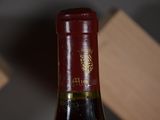 a bottle of wine that is sitting on a table