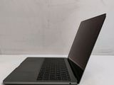 a laptop that is sitting on a white table