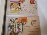 two envelopes in a box with a picture of a vase on them