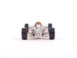 a close up of a toy racing car on a white surface