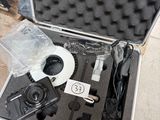 a case with a camera and a cd inside of it