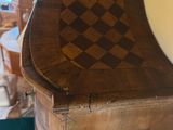 a wooden cabinet with a checkered design on it