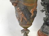 two vases sitting next to each other on a table