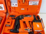 two orange tool cases with tools in them sitting on a table