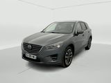 a grey mazda cx - 5 parked in a white room