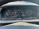 a close up of a car dashboard with a speedometer and gauges