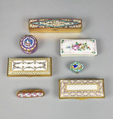 several different types of decorative boxes are arranged on a table