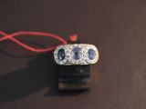 a ring with three blue sapphires on it on a table