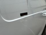 a close up of a car door handle with a sticker on it
