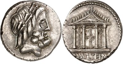 a silver coin with a woman ' s head and a building on it