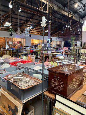 a large room filled with lots of art and furniture