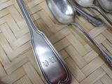 a lot of spoons and spoon spoons sitting on a table