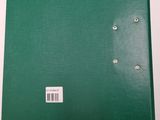 a green book with a white label on it