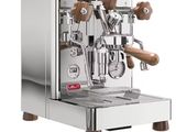 an image of a silver coffee machine with two wooden handles