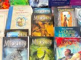 a lot of books that are sitting on a table