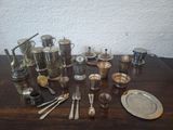 a wooden table with silverware and silverware on it