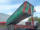 a green and red dump truck with a red trailer behind it