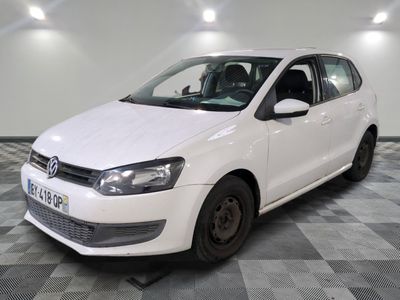 the white car is parked on a checkered floor in the garage
