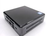 a small black computer sitting on a white surface