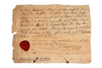 un gros plan sur un morceau de papier portant un cachet de cire