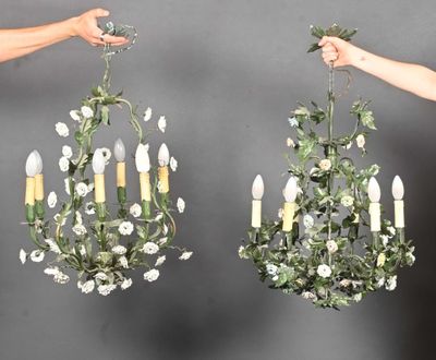 two chandeliers that are hanging from the ceiling